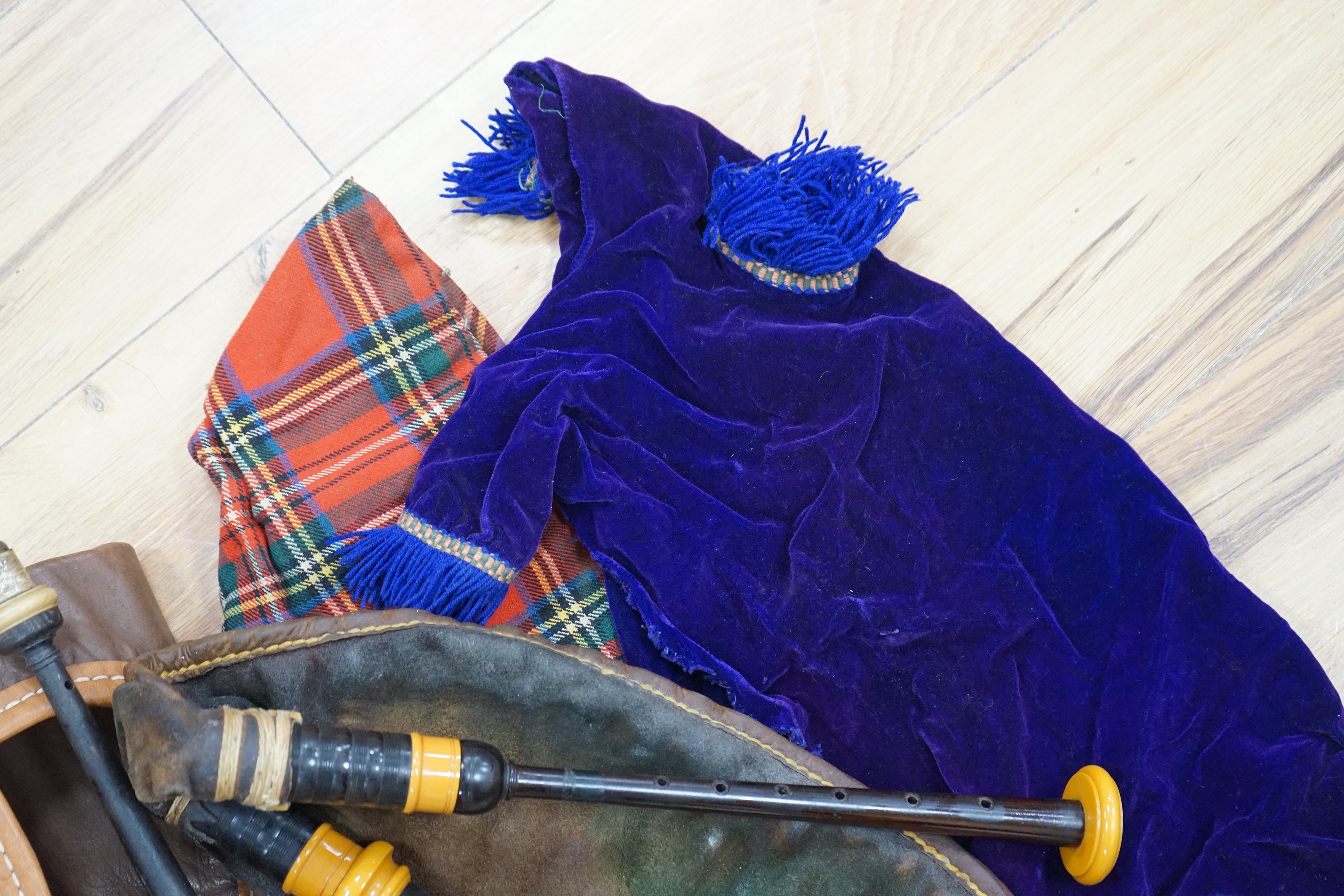 Two practice sets of bagpipes, one cased